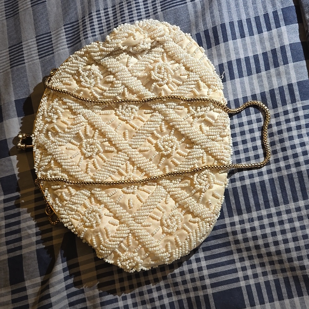 cream colored, fancy, beaded purse